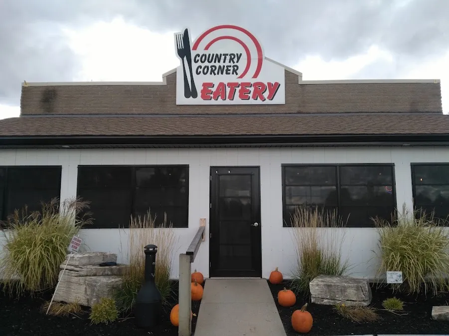 The front of Country Corner Eatery with its red fork logo sign